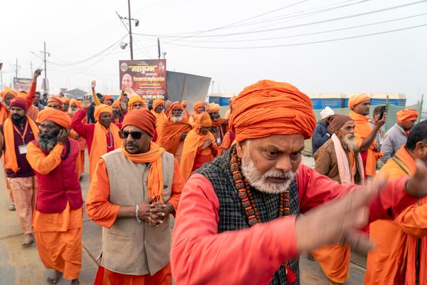 Hindu holy men walk in a procession a day before the 45-day-long Maha Kumbh festival, at the confluence of the Ganges, the Yamuna and the mythical Saraswati rivers, in Prayagraj, India, Sunday, Jan. 12, 2025. (AP Photo/Ashwini Bhatia)