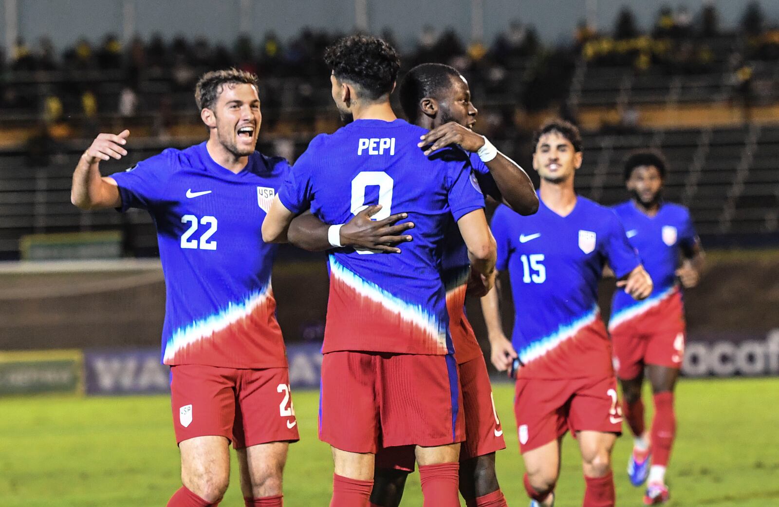 United States' Ricardo Pepi, center, celebrates scoring his side's first goal against Jamaica with teammates during a CONCACAF Nations League quarterfinal first leg soccer match in Kingston, Jamaica, Thursday, Nov. 14, 2024. (AP Photo/Collin Reid)