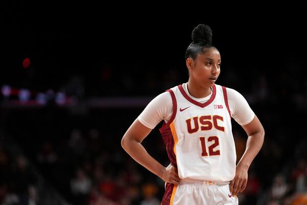 Southern California guard JuJu Watkins (12) reacts during the first half of an NCAA college basketball game against Notre Dame, Saturday, Nov. 23, 2024 in Los Angeles. (AP Photo/Eric Thayer)