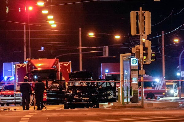 The car that was crashed into a crowd of people at the Magdeburg Christmas market is seen following the attack in Magdeburg, Germany, Saturday early morning, Dec. 21, 2024. (AP Photo/Ebrahim Noroozi)