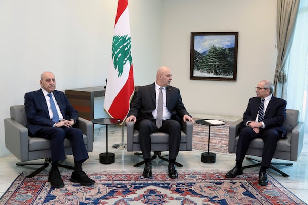 In this photo released by the Lebanese Presidency press office, Lebanese president Josephl Aoun, center, meets with Prime Minister-designate Nawaf Salam, right, and Parliament Speaker Nabih Berri, left, in Baabda, east of Beirut, Lebanon, Tuesday, Jan. 14, 2025. (Lebanese Presidency press office via AP)