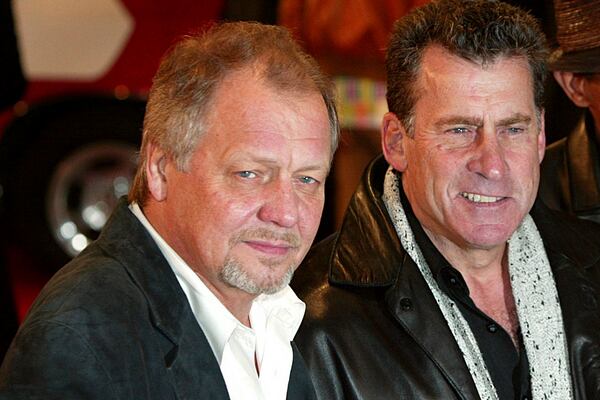 FILE - David Soul, left, and Paul Michael Glaser, stars of the original 1970's "Starsky and Hutch" television series, arrive at the British premiere of the new movie of the same name based on the TV series in London, March 11, 2004. (AP Photo/John D McHugh, File)