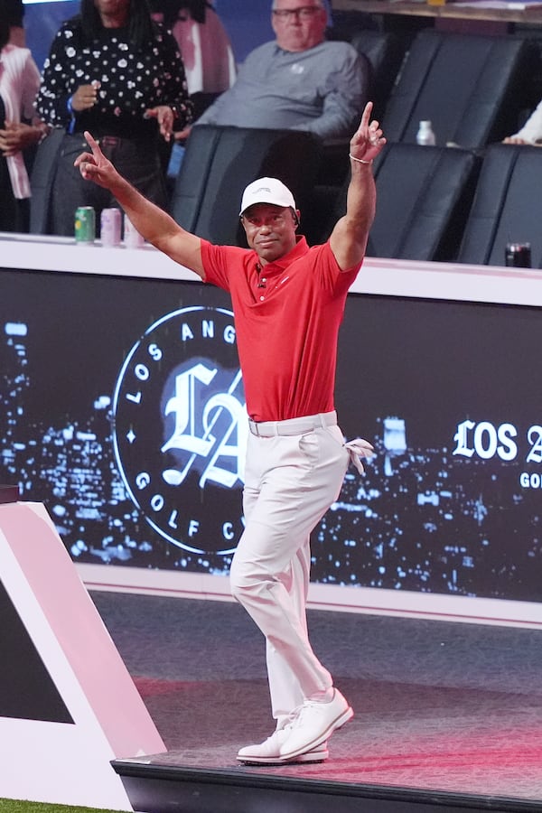 Tiger Woods is introduced before a match between Los Angeles Golf Club and his Jupiter Links Golf Club, Tuesday, Jan. 14, 2025, in Palm Beach Gardens, Fla. TGL featured two teams of three players competing against each other in a tech-infused arena the size of a football field. (AP Photo/Marta Lavandier)