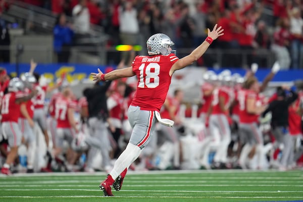 Ohio State quarterback Will Howard (18) celebrates after throwing a touchdown pass t- running back TreVeyon Henderson during the first half of the Cotton Bowl College Football Playoff semifinal game against Texas, Friday, Jan. 10, 2025, in Arlington, Texas. (AP Photo/Julio Cortez)