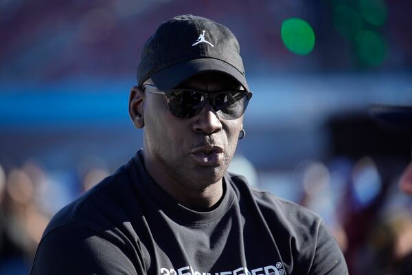 Michael Jordan, co-owner of 23XI Racing, watches during qualifying for a NASCAR Cup Series Championship auto race, Saturday, Nov. 9, 2024, in Avondale, Ariz. (AP Photo/John Locher)