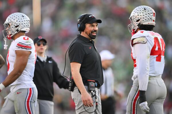 Ohio State head coach Ryan Day smiles during the first half in the quarterfinals of the Rose Bowl College Football Playoff against Oregon, Wednesday, Jan. 1, 2025, in Pasadena, Calif. (AP Photo/Kyusung Gong)