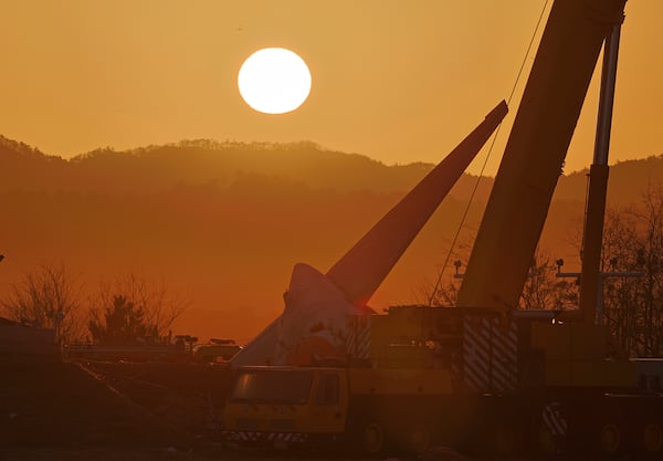 The first sunrise on New Year's day is seen near the site of a plane crash at Muan International Airport in Muan, South Korea, Wednesday, Jan. 1, 2025. (Son Hyung-ju/Yonhap via AP)