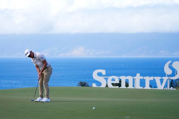 Collin Morikawa watches his birdie putt at the 10th hole during the second round of The Sentry golf event, Friday, Jan. 3, 2025, at the Kapalua Plantation Course in Kapalua, Hawaii. (AP Photo/Matt York)