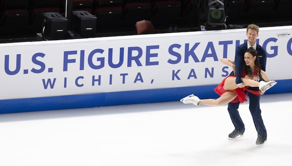 Madison Chock, front, and Evan Bates, back, perform during the ice dance rhythm dance competition at the U.S. figure skating championships Friday, Jan. 24, 2025, in Wichita, Kan. (AP Photo/Travis Heying)