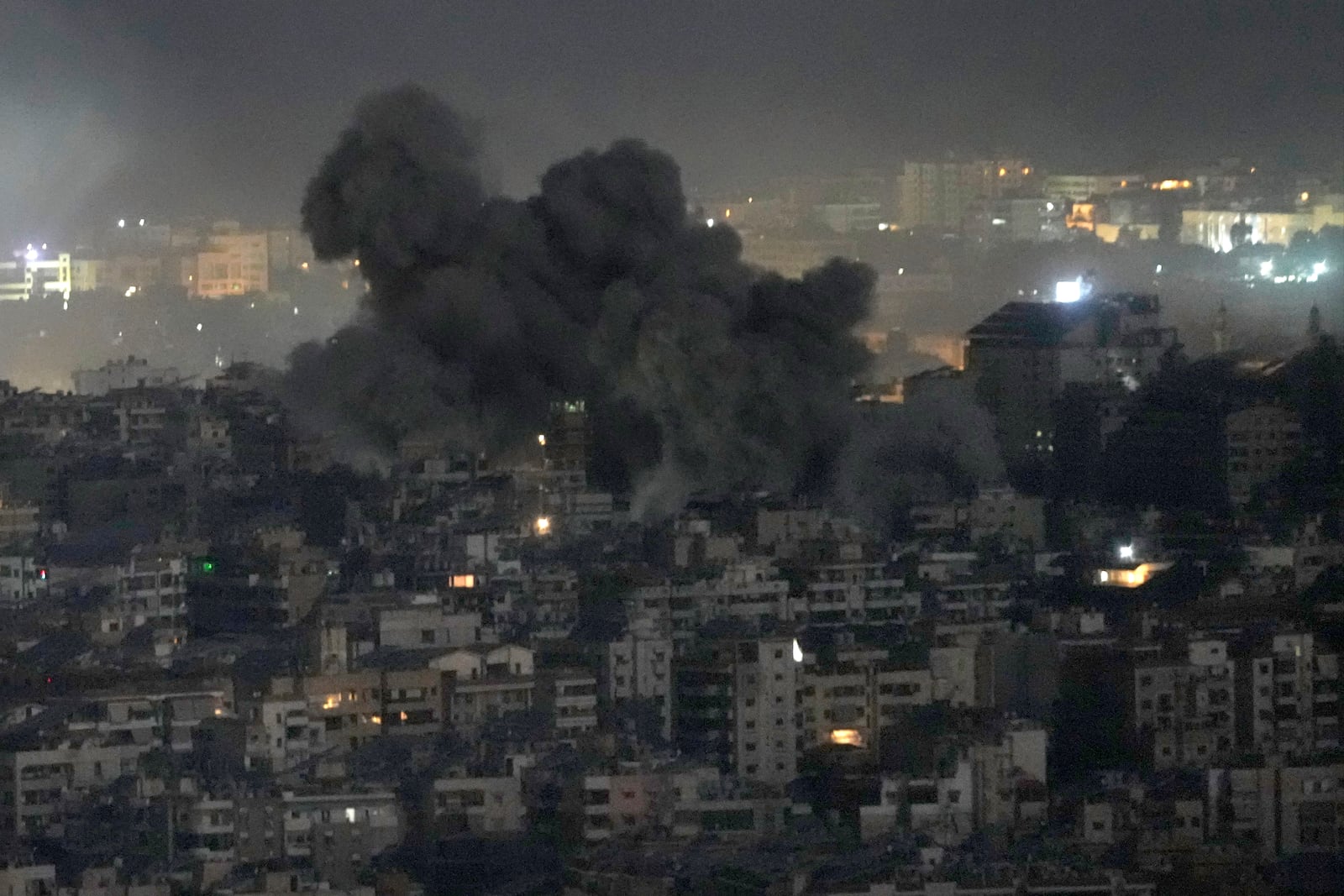 Smoke rises from an Israeli airstrike on Dahiyeh, in the southern suburb of Beirut, Lebanon, Sunday, Oct. 20, 2024. (AP Photo/Hussein Malla)