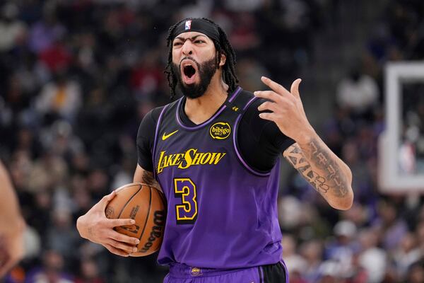 Los Angeles Lakers forward Anthony Davis yells to his team during the first half of an NBA basketball game against the Los Angeles Clippers, Sunday, Jan. 19, 2025, in Inglewood, Calif. (AP Photo/Mark J. Terrill)