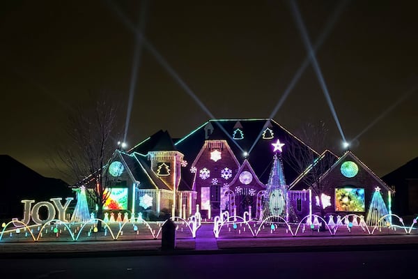 An elaborate holiday light display featuring music and imagery from the movie "Wicked" lights up the home of Elisabeth and Mark Miranda in Edmond, Okla.,, on Dec. 8, 2024. (Elisabeth Miranda via AP)