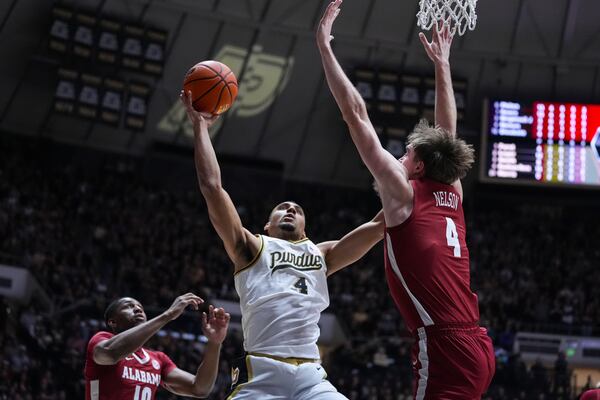 Purdue forward Trey Kaufman-Renn (4) shoots over Alabama forward Grant Nelson (4) during the second half of an NCAA college basketball game in West Lafayette, Ind., Friday, Nov. 15, 2024. (AP Photo/Michael Conroy)