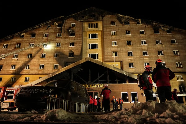 Firefighters and emergency teams work after a fire that broke out at a hotel in the ski resort of Kartalkaya, located in Bolu province, northwest Turkey, on Tuesday, Jan. 21, 2025. (AP Photo/Francisco Seco)