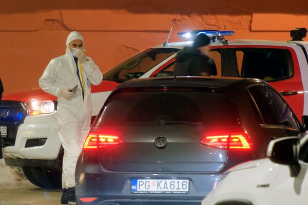 Police investigators work at the site of a shooting in Cetinje, 36 kilometers (22 miles) west of Podogrica, Montenegro, Wednesday, Jan 1, 2025. (AP Photo/Risto Bozovic)