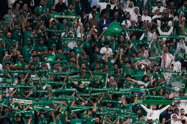 FILE - Saudi Arabia fans support their team during the Asian Cup Round of 16 soccer match between Saudi Arabia and South Korea, at the Education City Stadium in Al Rayyan, Qatar, Jan. 30, 2024. (AP Photo/Thanassis Stavrakis, File)