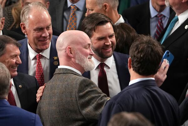 Vice President-elect JD Vance is congratulated after a joint session of Congress confirmed the Electoral College votes, affirming President-elect Donald Trump's victory in the presidential election, Monday, Jan. 6, 2025, at the U.S. Capitol in Washington. (AP Photo/Matt Rourke)