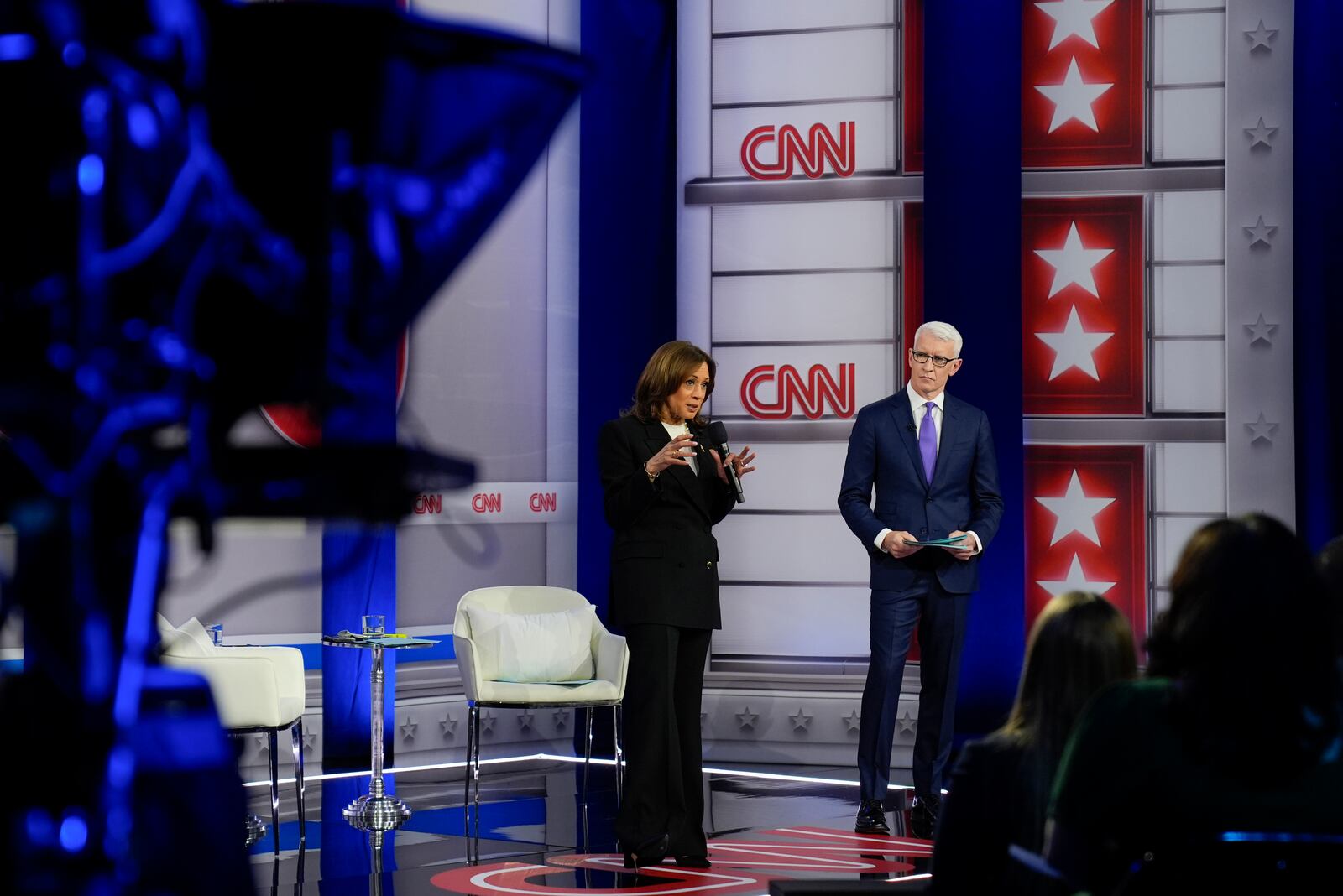 Democratic presidential nominee Vice President Kamala Harris speaks during a CNN town hall in Aston, Pa., Wednesday, Oct. 23, 2024, as moderator Anderson Cooper listens. (AP Photo/Matt Rourke)