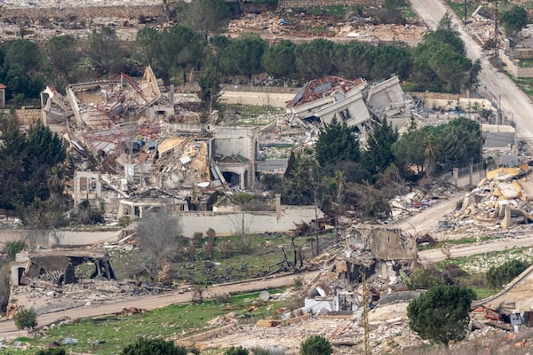 Destroyed buildings in southern Lebanon, as seen from northern Israel, Sunday, Jan. 26, 2025. (AP Photo/Ariel Schalit)