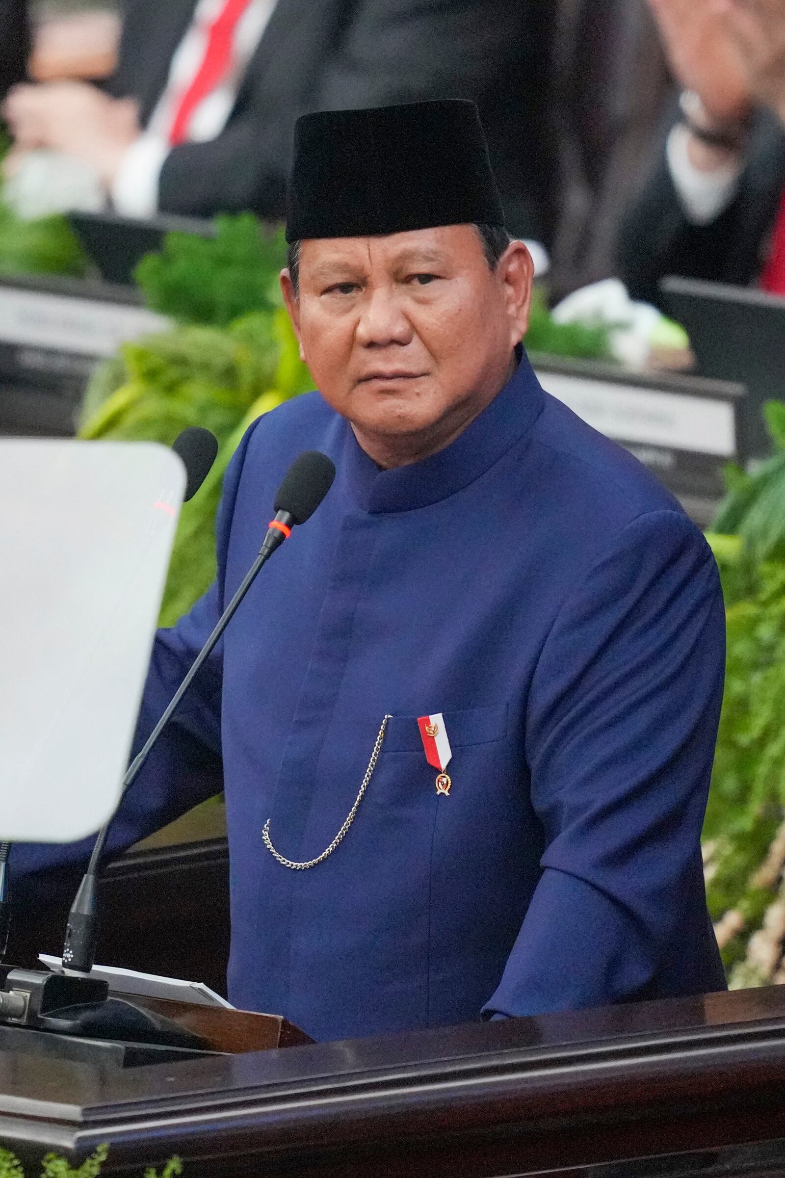 Indonesia's newly-inaugurated President Prabowo Subianto delivers a speech during the presidential inauguration ceremony at the Parliament building in Jakarta, Indonesia, Sunday, Oct. 20, 2024. (AP Photo/Tatan Syuflana)