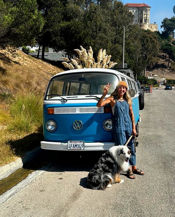 PLEASE HOLD FOR USE WITH STORY-dog Bodi in front of her VW van on Sept. 30, 2024 in Malibu, Calif. (Macy DiCenso via AP)