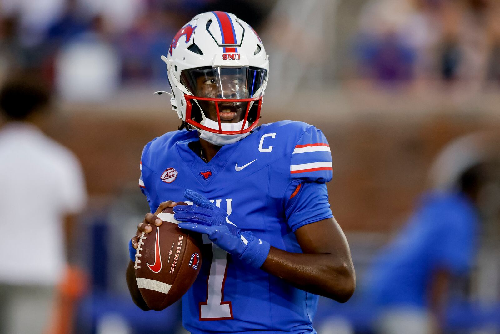 SMU quarterback Kevin Jennings warms up before an NCAA college football game against Pittsburgh in Dallas, Saturday, Nov. 2, 2024. (AP Photo/Gareth Patterson)