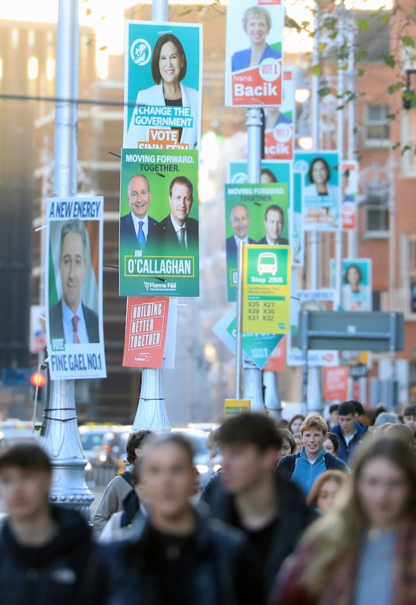 Irish election posters hang from lamp posts in Dublin City centre, Tuesday, Nov. 26, 2024, ahead of Ireland's election on Friday. (AP Photo/Peter Morrison)