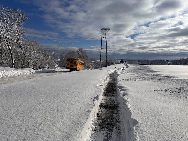 A school bus is on a delayed schedule after a snow storm in Lowville, N.Y., Monday, Dec. 2, 2024. (AP Photo/Cara Anna)