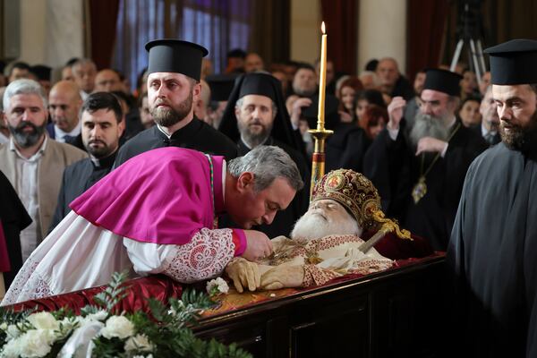 Senior clergy from the Catholic and Orthodox churches pays respects to the late Archbishop Anastasios of Tirana, Durres and All Albania during his funeral, inside the Cathedral of the Resurrection of Christ, in Tirana, Albania, Thursday, Jan. 30, 2025. (AP Photo/Vlasov Sulaj)