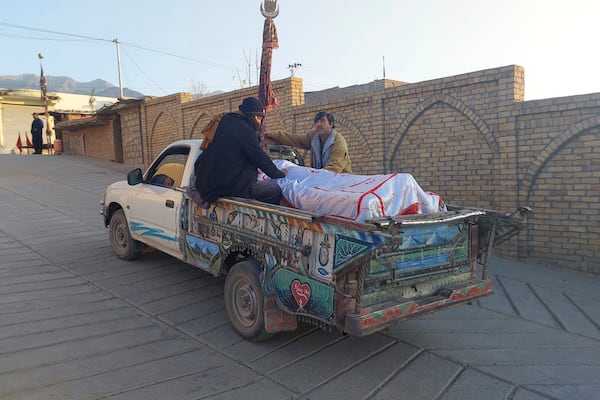 Relatives transport the body of a victim of a gunmen firing incident, after collecting it from a hospital, in Parachinar, main town of Kurram district of Pakistan's northwestern Khyber Pakhtunkhwa province, Friday, Nov. 22, 2024. (AP Photo/Hussain Ali)