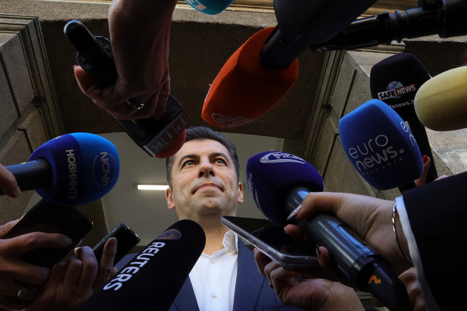 Former Bulgarian Prime Minister Kiril Petkov speaks to media after voting at a polling station during the general elections in Sofia, Sunday, Oct. 27, 2024. (AP Photo/Valentina Petrova)