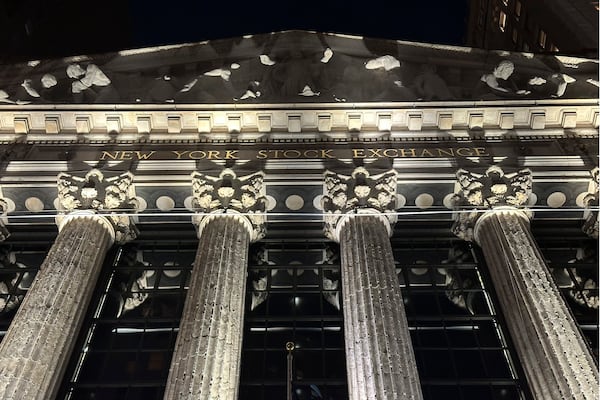 The facade of the New York Stock Exchange is illuminated on Tuesday, Nov. 19, 2024. (AP Photo/Peter Morgan)