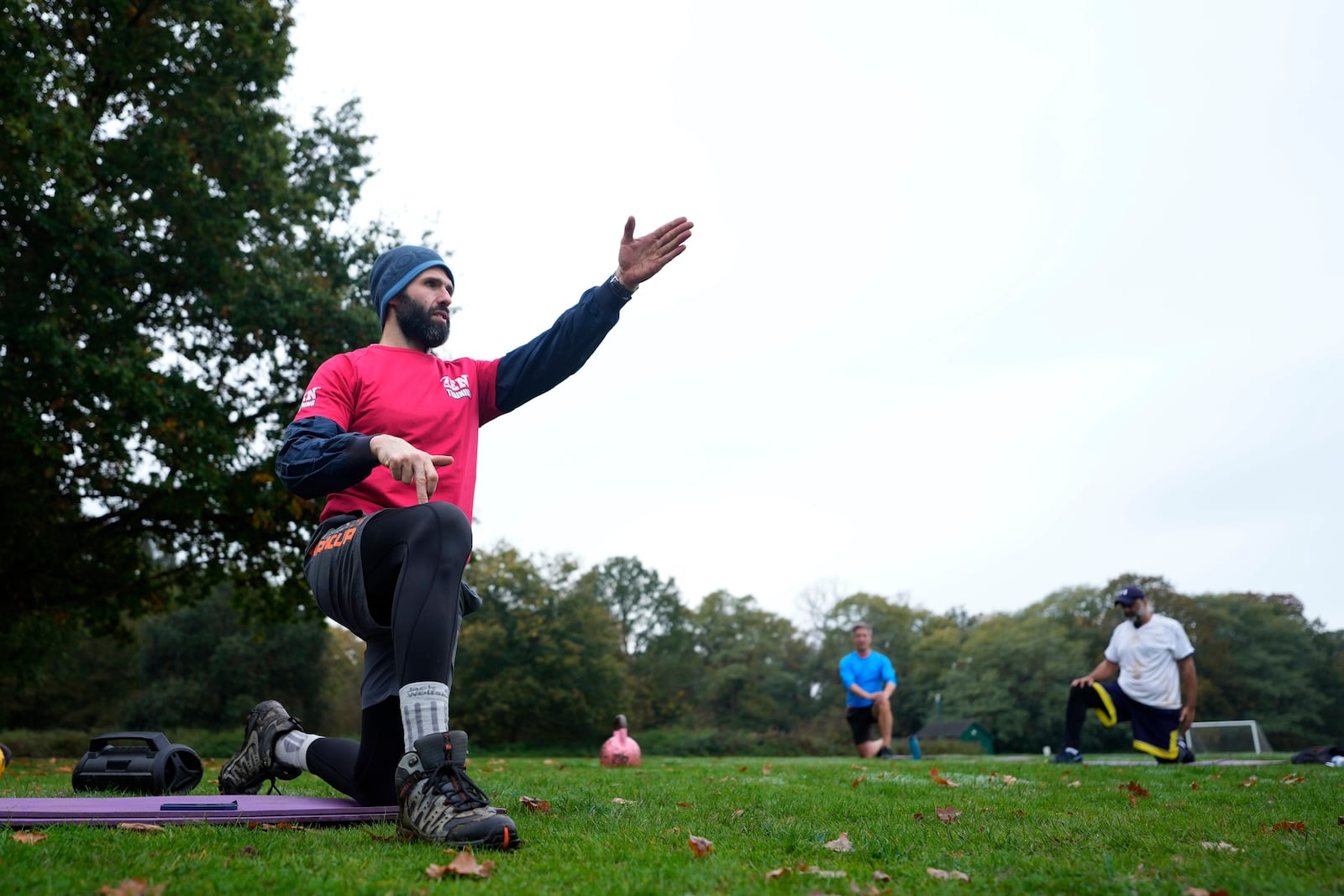 Personal fitness trainer Richard Lamb, gestures as he leads an outdoor gym class in London, Saturday, Oct. 26, 2024. (AP Photo/Alastair Grant)