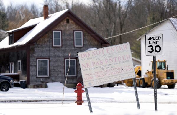 A sign on an unpatrolled border street entering into Derby Line, Vermont, U.S.A., from Stanstead, Quebec, oTuesday, Jan. 21, 2025. (Christinne Muschi/The Canadian Press via AP)