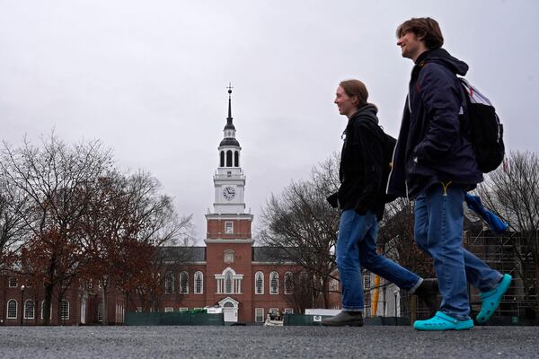 FILE - Students cross the campus of Dartmouth College, March 5, 2024, in Hanover, N.H. (AP Photo/Robert F. Bukaty, File)