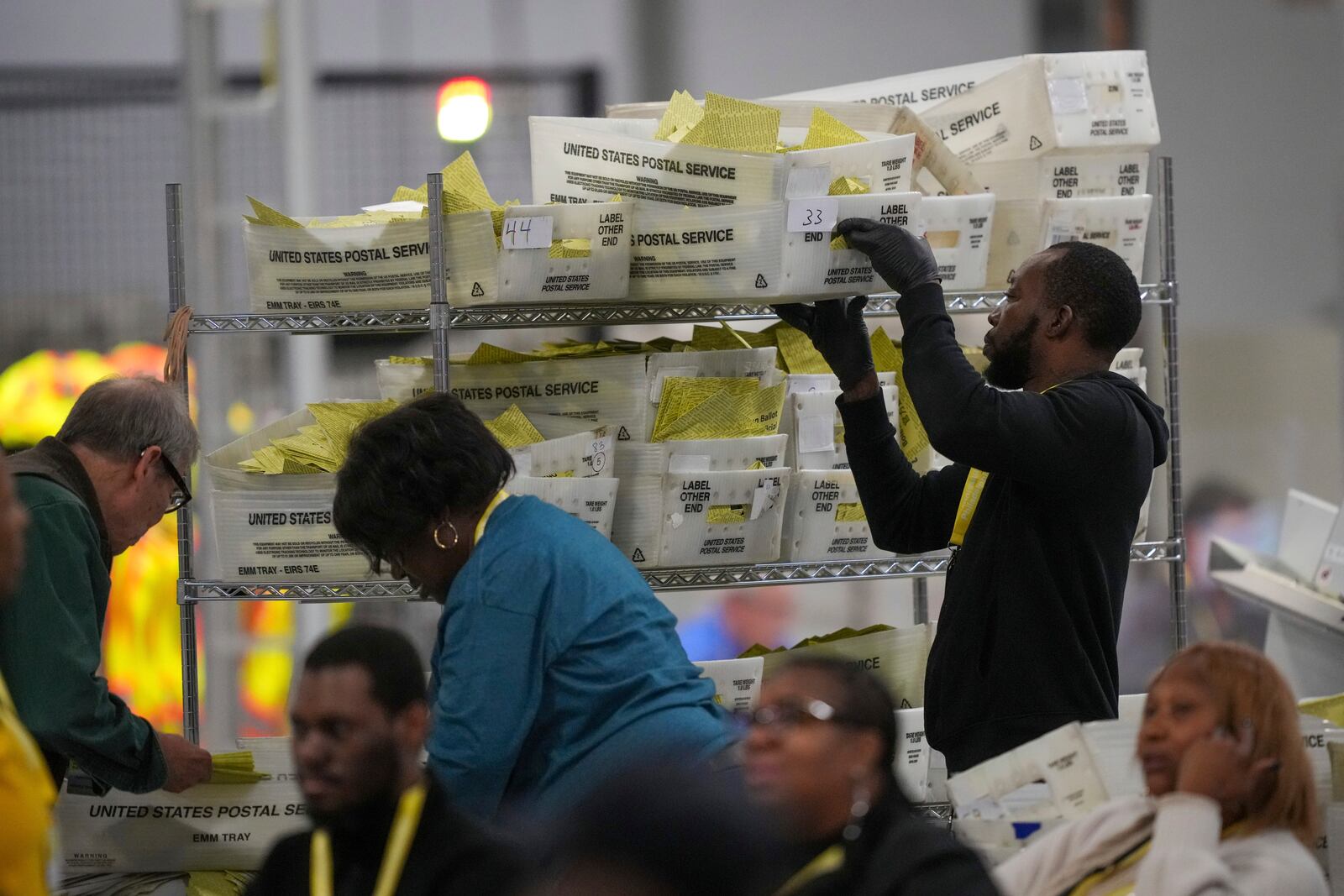 Election workers process mail-in ballots for the 2024 General Election at the Philadelphia Election Warehouse, Tuesday, Nov. 5, 2024, in Philadelphia. (AP Photo/Matt Rourke)