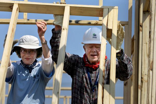 FILE - Former President Jimmy Carter, right, and former first lady Rosalynn Carter help build a Habitat for Humanity house in Violet, La., May 21, 2007. The pair were working on the 1,000th Habitat for Humanity house in the Gulf Coast region since hurricanes Katrina and Rita. (AP Photo/Alex Brandon, File)