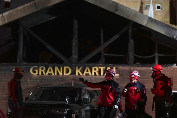 Firefighters and emergency teams work after a fire that broke out at a hotel in the ski resort of Kartalkaya, located in Bolu province, northwest Turkey, on Tuesday, Jan. 21, 2025. (AP Photo/Francisco Seco)