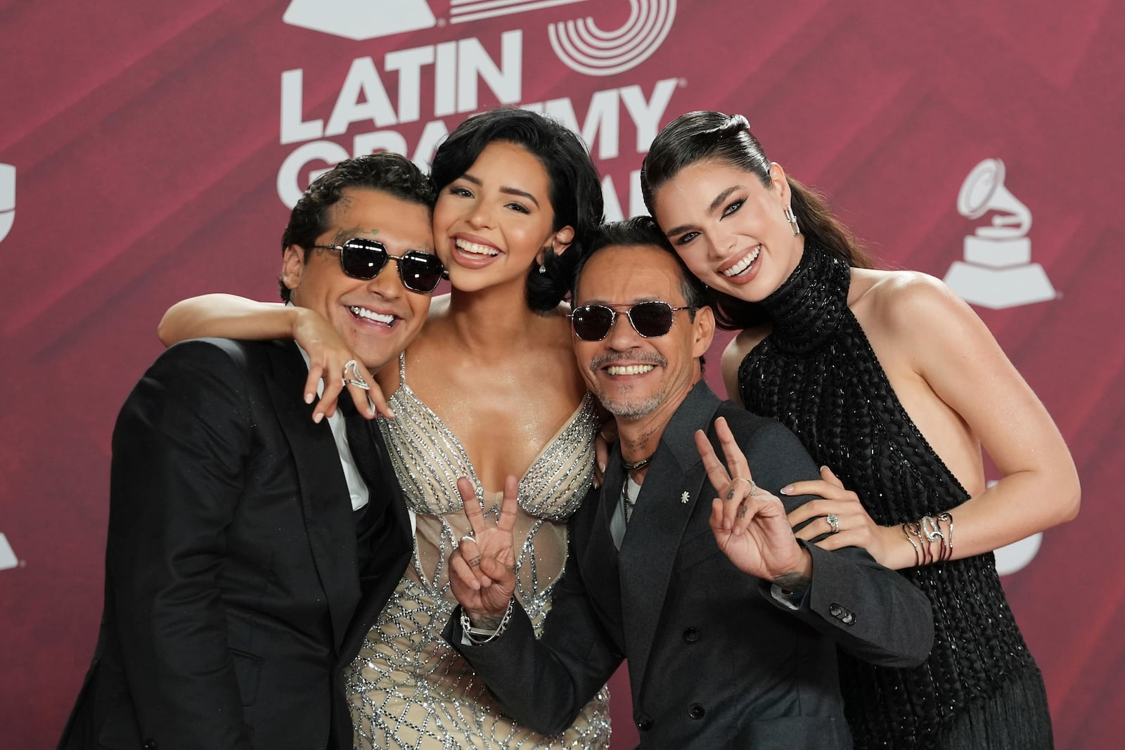 Christian Nodal, Angela Aguilar, Marc Anthony and Nadia Ferreira arrive at the 25th Latin Grammy Awards ceremony, Thursday, Nov. 14, 2024, in Miami. (AP Photo/Rebecca Blackwell)