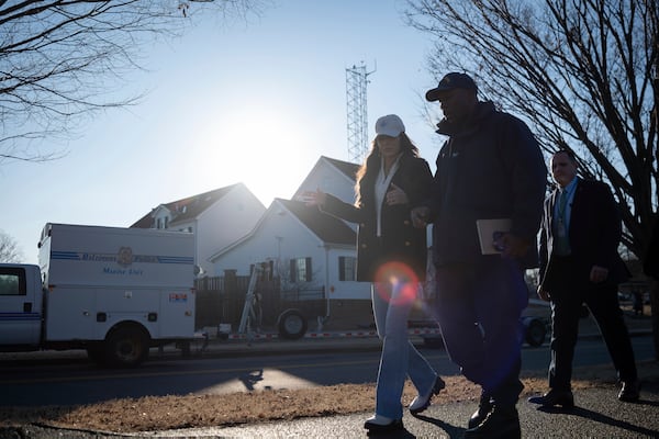 In this image provided by the U.S. Coast Guard, Secretary of Homeland Security Kristi Noem discusses response efforts with Capt. Patrick Burkett, commander, Coast Guard Sector Maryland - National Capital Region, outside Coast Guard Station Washington D.C., Thursday, Jan. 30, 2025 in Washington. (Petty Officer 1st Class Brandon Giles, U.S. Coast Guard via AP)