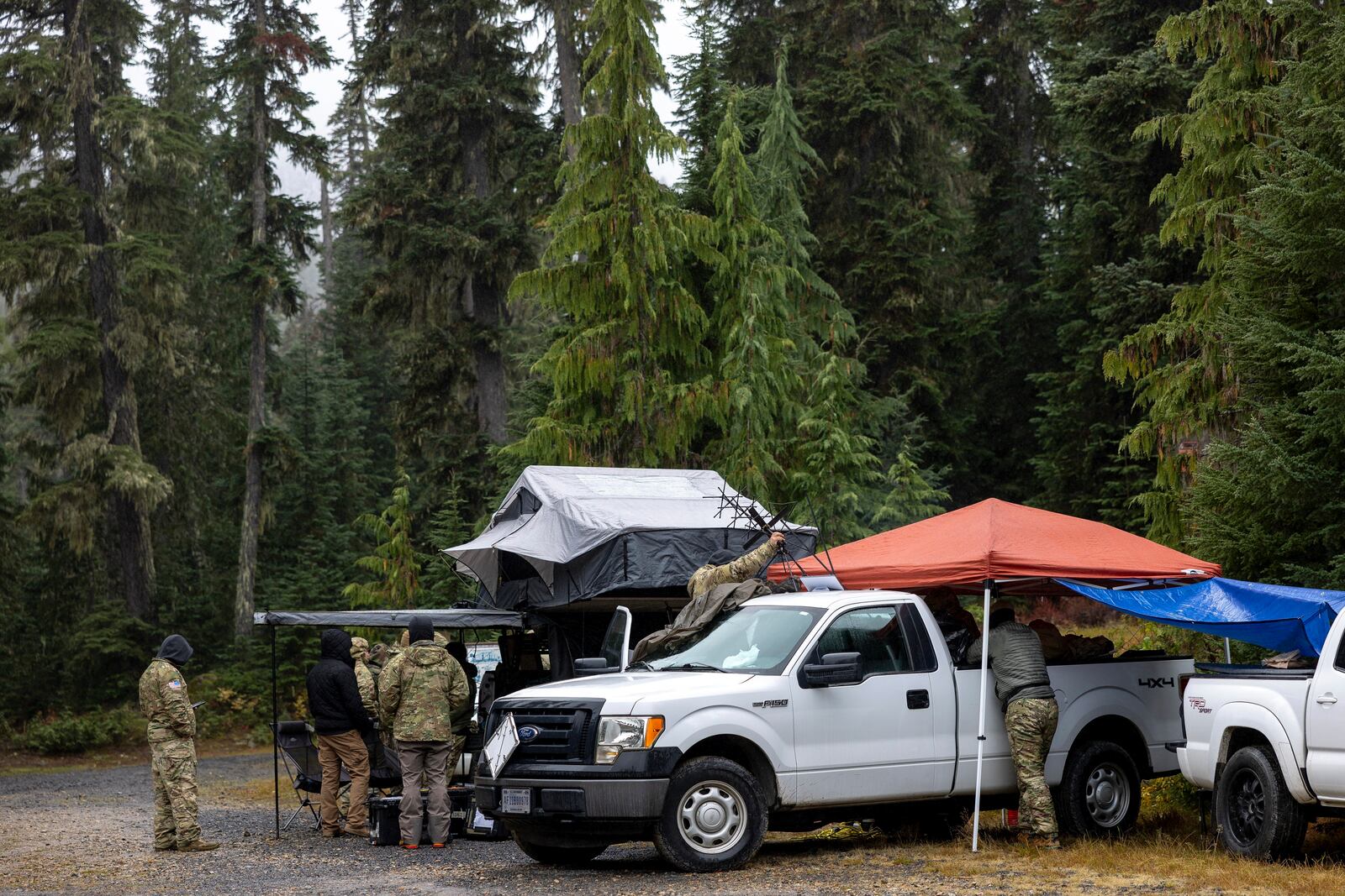 About 30 members of the U.S. Army's 1st Special Forces Group, Airborne Division meet for a search and rescue operation for the two missing Navy aviators on Friday, Oct. 18, 2024, near Goose Prairie, Yakima County, Wash. (Nick Wagner/The Seattle Times via AP)