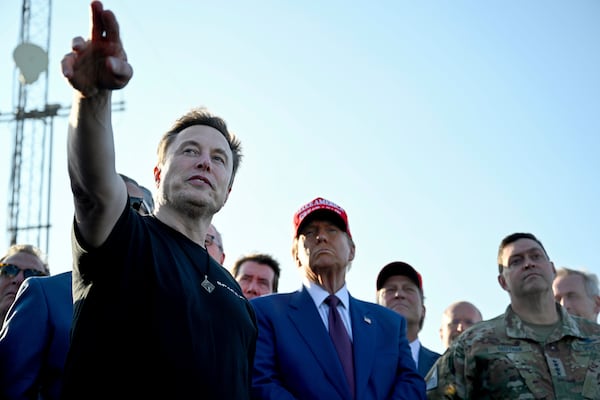 President-elect Donald Trump listens to Elon Musk at the launch of the sixth test flight of the SpaceX Starship rocket Tuesday, Nov. 19, 2024 in Boca Chica, Texas. (Brandon Bell/Pool via AP)