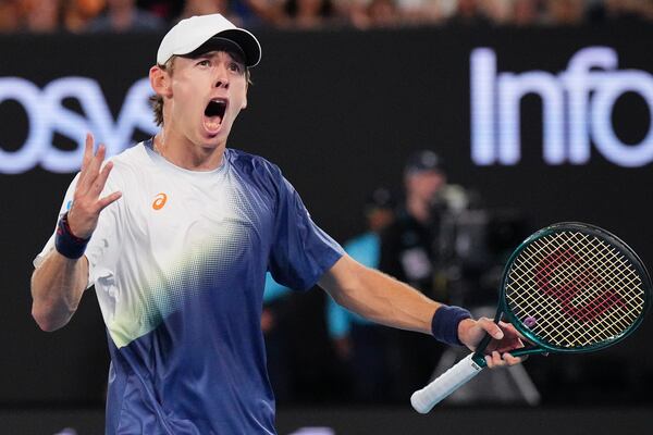 Alex de Minaur of Australia reacts after winning a point against Alex Michelsen of the U.S. during their fourth round match at the Australian Open tennis championship in Melbourne, Australia, Monday, Jan. 20, 2025. (AP Photo/Vincent Thian)