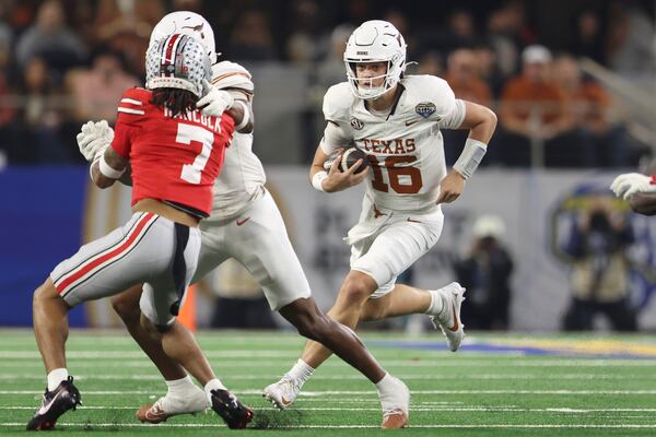 Texas quarterback Arch Manning (16) runs against Ohio State during the first half of the Cotton Bowl College Football Playoff semifinal game, Friday, Jan. 10, 2025, in Arlington, Texas. (AP Photo/Gareth Patterson)