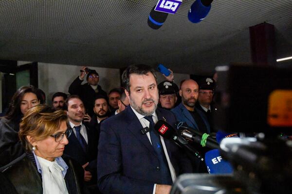 Italy's vice Premier Matteo Salvini, flanked by his lawyer Giulia Bongiorno, left, speaks to journalists as he leaves a Palermo's law court in Sicily, Italy, Friday, Dec. 20, 2024, after he was acquitted in a first instance trial where he was accused of blocking for 19 days the disembarkation of 147 people, including minors, rescued at sea by the NGO Open Arms in August 2019.(AP Photo/Salvatore Cavalli)