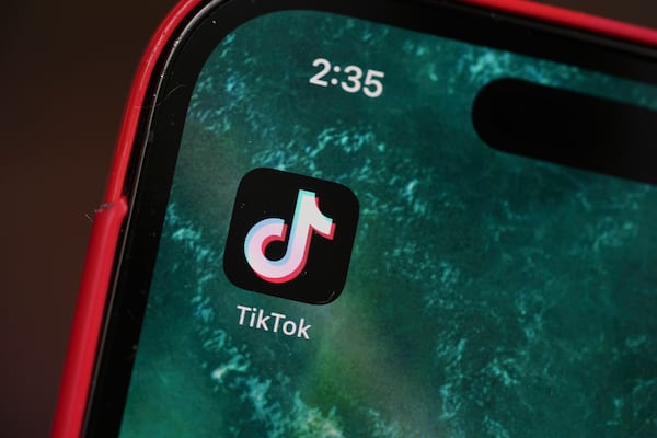 The logo for TikTok is displayed on a mobile phone, Friday, Jan. 17, 2025, in Denver. (AP Photo/David Zalubowski)