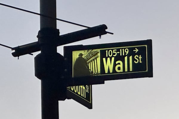 A sign marking the intersection of Wall Street and South Street is shown in New York's Financial District on Tuesday, Nov. 26 2024. (AP Photo/Peter Morgan)