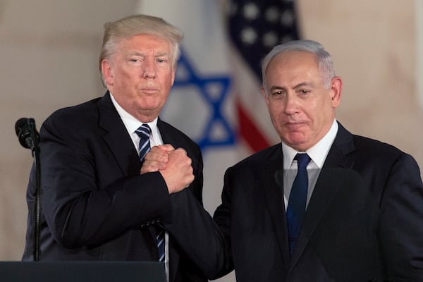 FILE - President Donald Trump and Israeli Prime Minister Benjamin Netanyahu shake hands at The Israel Museum in Jerusalem, May 23, 2017. (AP Photo/Sebastian Scheiner, File)