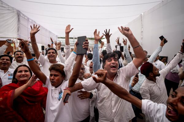 Congress party supporters cheer as they follow proceedings of vote counting at their party headquarters in New Delhi, India, Tuesday, June 4, 2024. India began counting more than 640 million votes Tuesday in the world's largest democratic exercise, which was widely expected to return Prime Minister Narendra Modi to a third term after a decade in power. (AP Photo/Altaf Qadri)