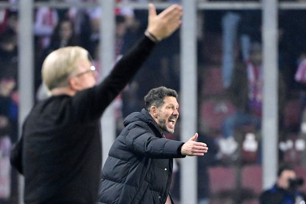 Atletico's head coach Diego Simeone, right, gestures during the UEFA Champions League opening phase soccer match between between Sparta Prague and Athletico Madrid in Prague, Czech Republic, Tuesday, Nov. 26, 2024. (Roman Vondrous/CTK via AP)